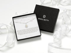 Sterling silver daisy necklace with gold-plated centre, 12mm pendant, 16-18 inch chain, in Bijou Betty gift box.