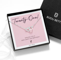 Close up of 21st birthday sterling silver heart necklace in gift box.