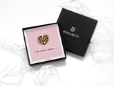 Bijou Betty’s new chapter pin gift set, with a gold-plated heart enamel pin on a card reading A New Chapter Begins, with tissue wrapping and optional gift box and bag.