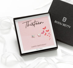 Bijou Betty’s 13th birthday earrings gift set, with 925 sterling silver butterfly studs in a gift box with matching bag, tissue, and card reading, “Thirteen - HAPPY BIRTHDAY!”