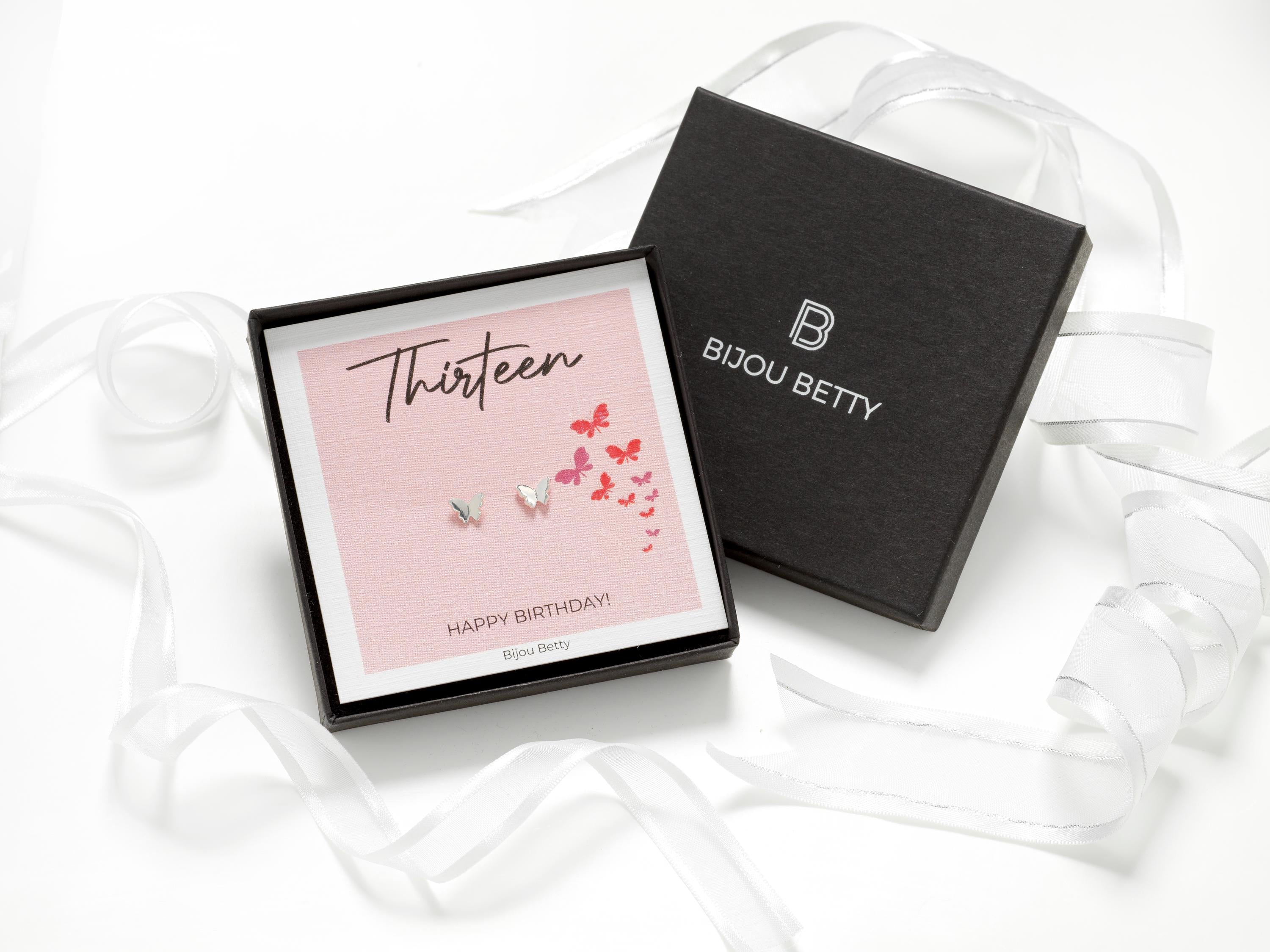 Bijou Betty’s 13th birthday earrings gift set, with 925 sterling silver butterfly studs in a gift box with matching bag, tissue, and card reading, “Thirteen - HAPPY BIRTHDAY!”