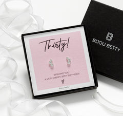Close-up of Bijou Betty’s 925 silver 30th birthday stud earrings, 9.5mm x 6mm with cubic zirconia, silver or rose gold plate, on white background.