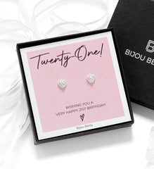 Close up of 21st birthday silver heart earrings in a luxury gift box.