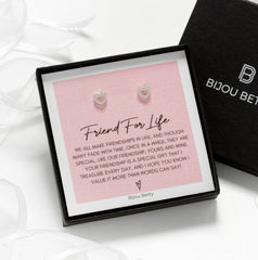 Close up of sterling silver 6mm x 7mm open-heart stud earrings in Bijou Betty gift box with friendship card, ideal for best friend gift.