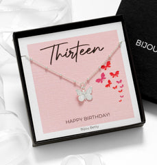 Close up of silver butterfly necklace for 13th birthday gift.