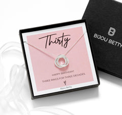 Close up of sterling silver 30th birthday necklace, 14mm interlocked rings, 925 silver, 16–20in chain, gift for daughter, in Bijou Betty gift box.