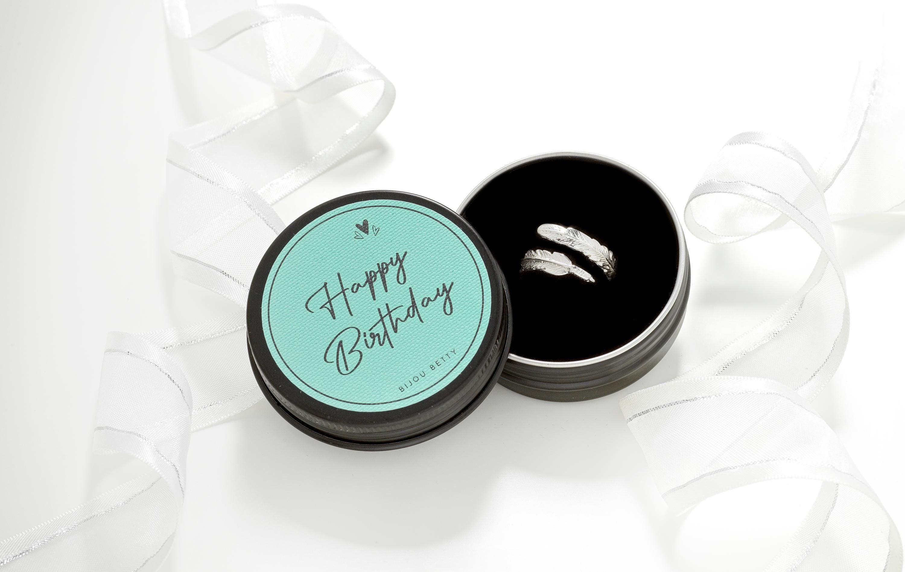 Adjustable solid silver feather ring in a Happy Birthday gift box.