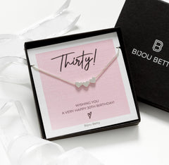 Close-up of Bijou Betty’s 925 sterling silver 30th birthday necklace with a three-heart pendant, on a 16–18 inch adjustable chain