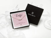 Bijou Betty’s 30th birthday necklace gift set, with a 925 sterling silver three-heart necklace, in a gift box with ribbon, tissue, and a card reading, Thirty! WISHING YOU A VERY HAPPY 30TH BIRTHDAY!