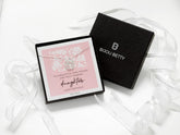 Bijou Betty’s daughter necklace gift set, with 925 sterling silver three-ring necklace in a gift box with bag, tissue, polishing cloth, and card reading, To a beautiful, kind, strong, and truly amazing Daughter.