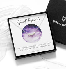 Close up of Bijou Betty’s best friend gift, 925 silver star bead necklace in gift box with bag, tissue, and card: “Good friends are like stars…