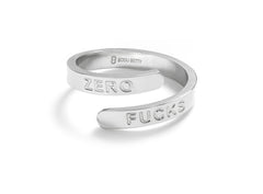 Close-up of Bijou Betty’s stainless steel wrap ring, adjustable, engraved ZERO FUCKS, on white background.