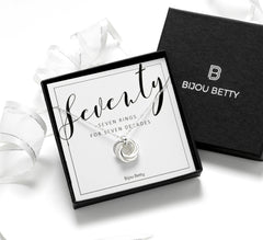Close up of sterling silver 70th birthday necklace with 14mm 7 rings pendant, adjustable 18-20 inch chain, in gift box with card.