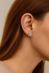 The model is wearing 70th birthday earrings. Sterling silver with cubic zirconia stones.