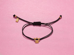 Close-up of 13mm stainless steel angel on black cord bracelet, perfect for sympathy or birthday gifts.