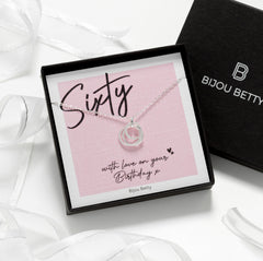 Close-up of 925 silver 3-ring necklace with plain, textured, and CZ rings, perfect for 60th birthday gifts.