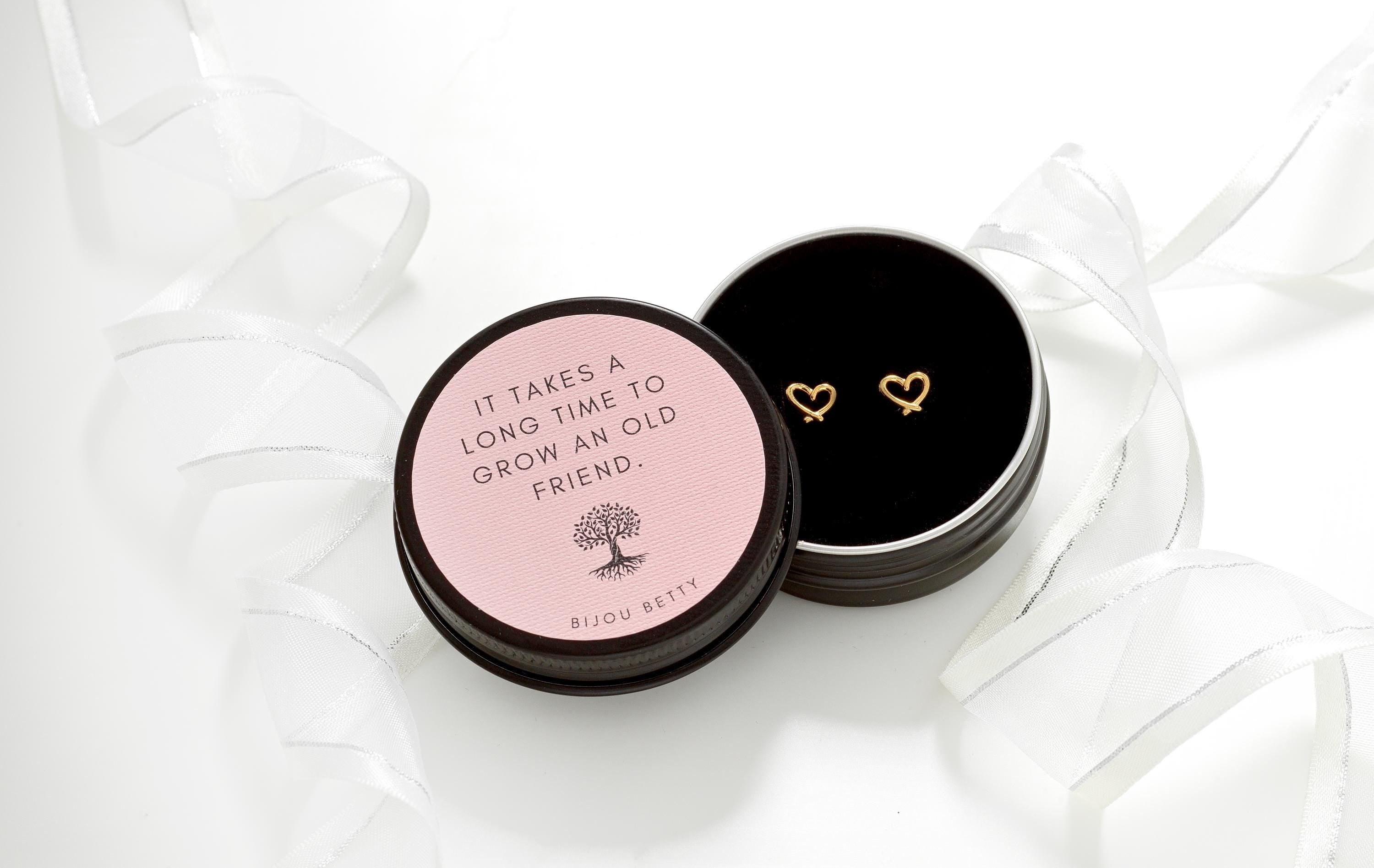 Gold-plated stainless steel 7mm heart stud earrings in Bijou Betty gift box with friendship quote, ideal for birthdays.