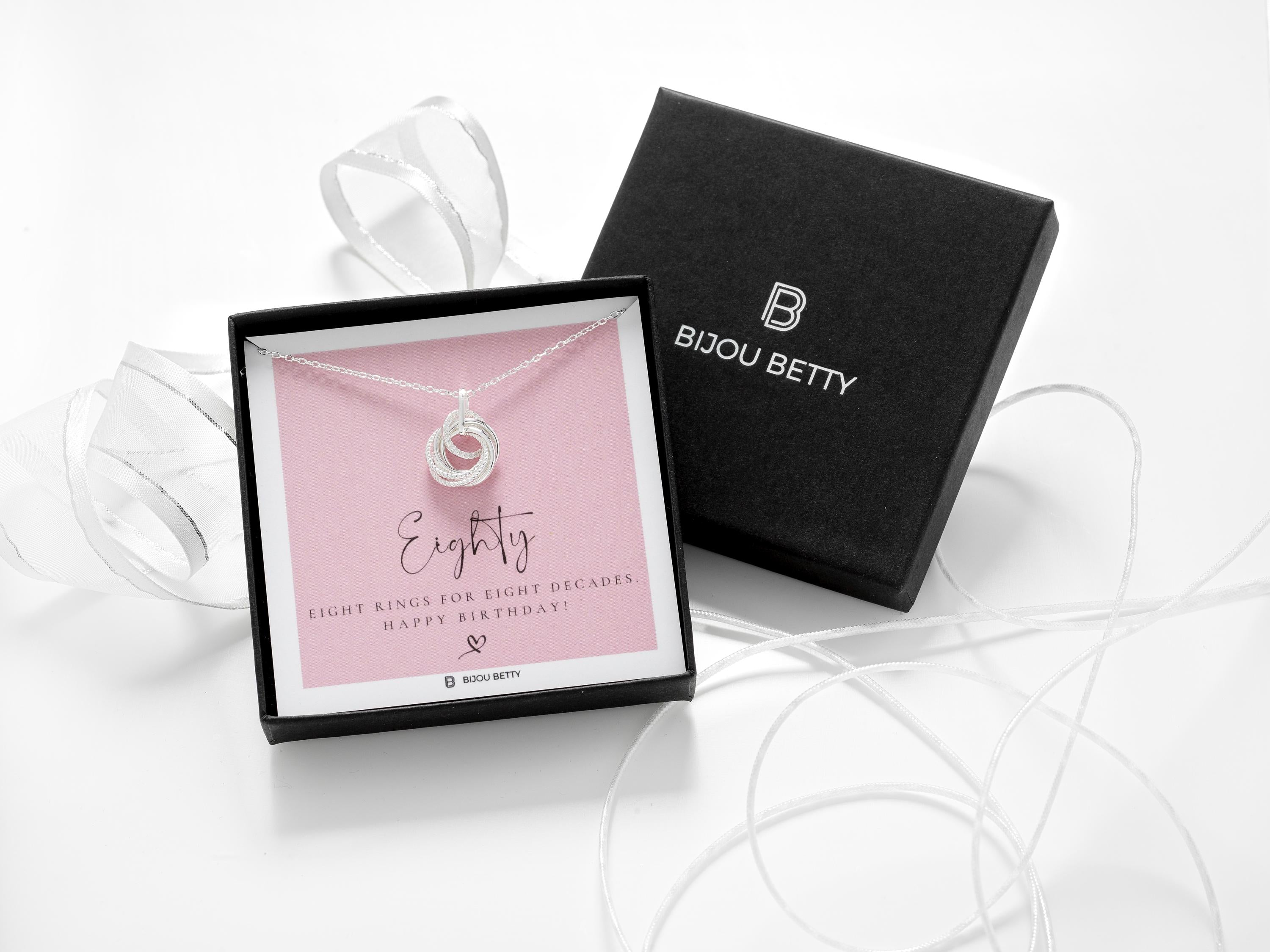 80th birthday 8 rings necklace in a gift box.