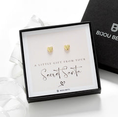 Close-up of 14k gold-plated heart earrings, perfect for Christmas gifts for sisters.