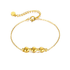 Close-up of gold-plated stainless steel 3 heart bracelet, perfect for 21st birthday gifts for sisters.