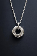Silver 60th birthday necklace with 6 interlinked rings, each ring represents a decade.