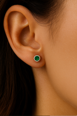 Model wearing emerald cz birthstone stud earrings