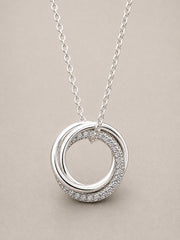 Silver 3 ring necklace with cubic zirconia stones.