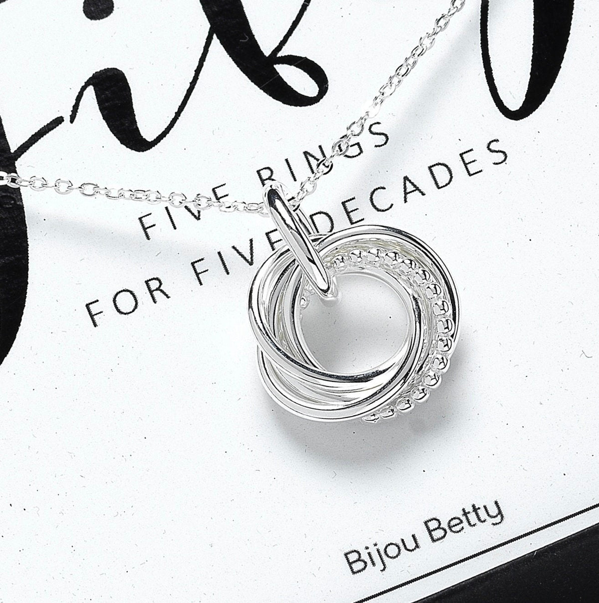 Sterling silver 50th birthday circle necklace with five rings.