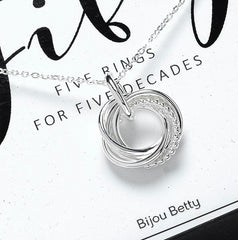 Sterling silver 50th birthday circle necklace with five rings.