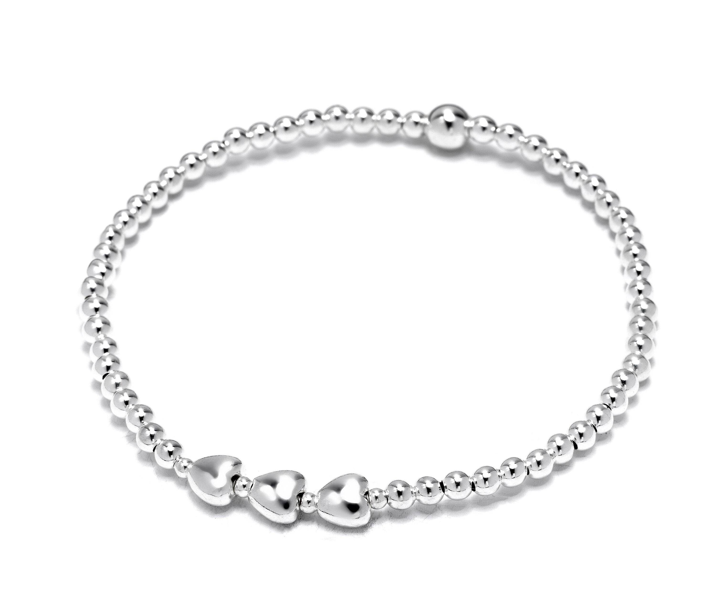 Close-up of Bijou Betty’s 925 silver 30th birthday bracelet with three heart pendants and 3mm beads, stretch-fit, on white background.