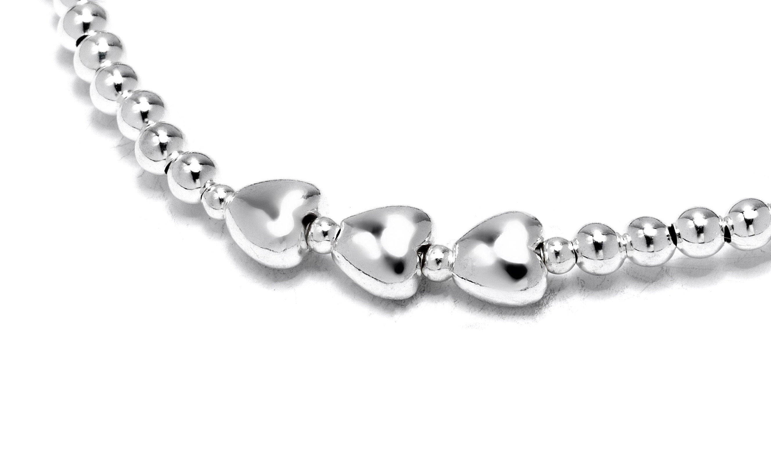 Sterling silver friendship heart bracelet with three heart beads.
