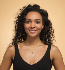 Model wearing Bijou Betty’s 925 sterling silver daughter necklace, featuring three interlinked rings with cubic zirconia, on a 16–18 inch adjustable chain, styled elegantly.