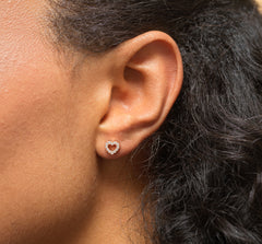 Model wearing 16th birthday heart cz stud earrings.