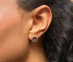 Model wearing sterling silver with rose gold plating 18th birthday circle earrings.