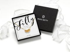 14K gold-plated over sterling silver necklace with five interlinked hammered rings, symbolising five decades. Includes gift box, matching gift bag, tissue paper, and card: Fifty - Five Rings for Five Decades.
