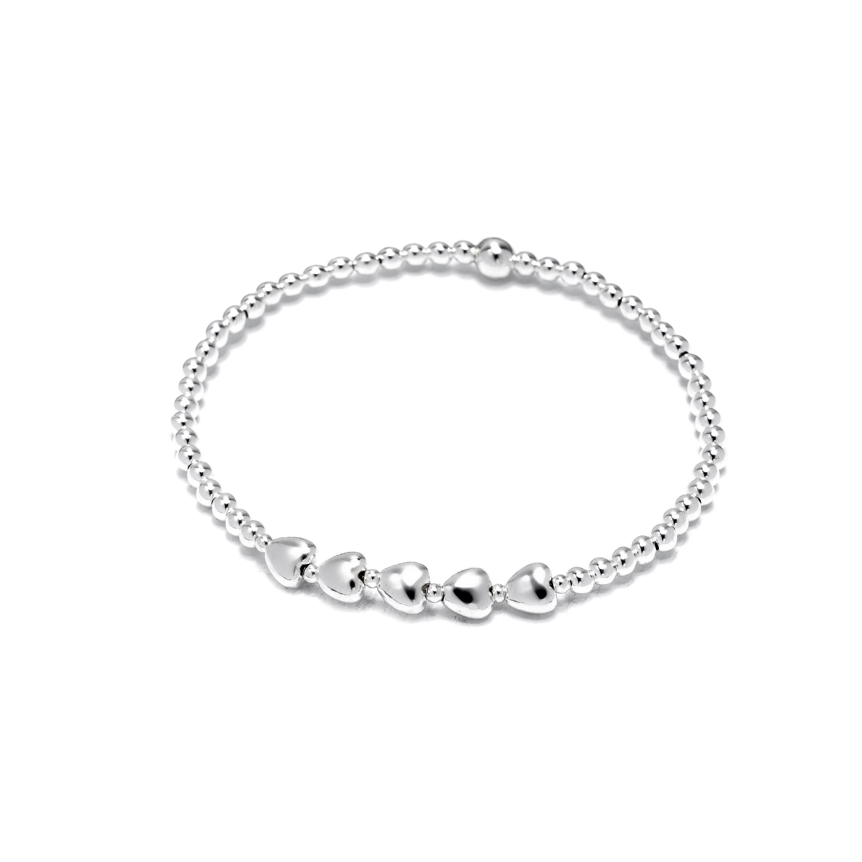 Sterling silver bracelet with 5 heart charms for a 50th birthday. Includes gift box, bag, tissue paper, and a card explaining the five hearts&#39; meaning. Perfect milestone gift for mum, wife, sister, or friend.