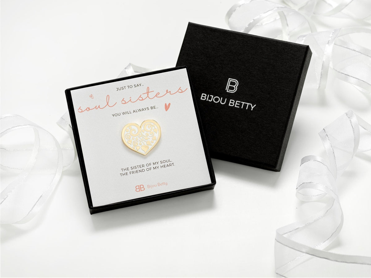 Gift for friend who is like a sister to you.  Enamel heart pin badge with a floral motif.  Presented on a card that reads:  Soul sister, you will always be the sister of my soul, the friend of my heart.