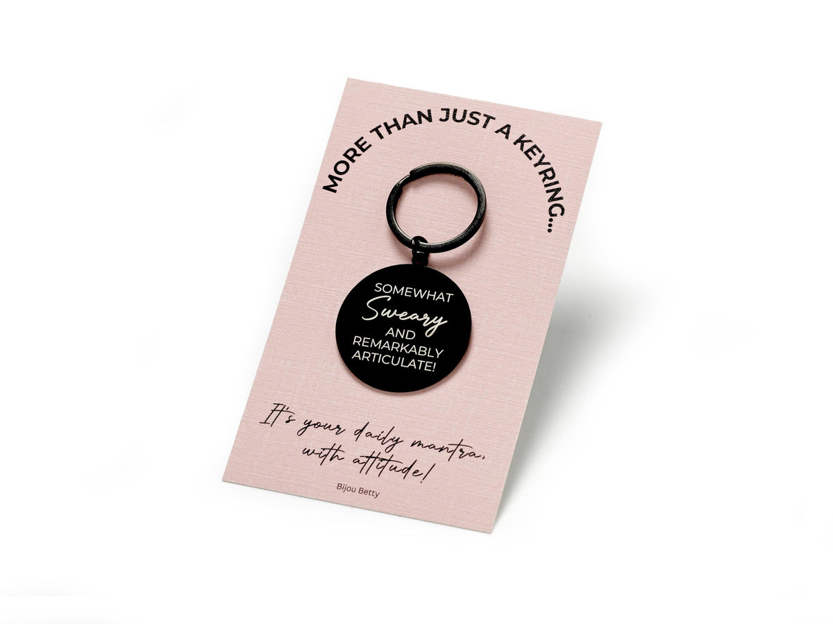 Stainless steel keyring engraved with the phrase &#39;Somewhat sweary and remarkably articulate.&#39; A bold and cheeky gift for friends, sisters, or yourself, perfect for birthdays, Christmas, or just because.