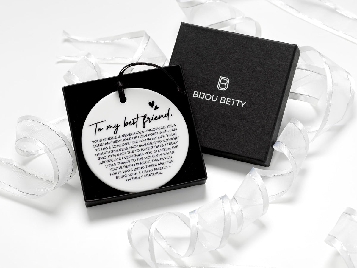 Ceramic round friendship gift (75mm diameter) with best friend quote and black satin ribbon, wrapped in tissue paper, optional gift box or bag.
