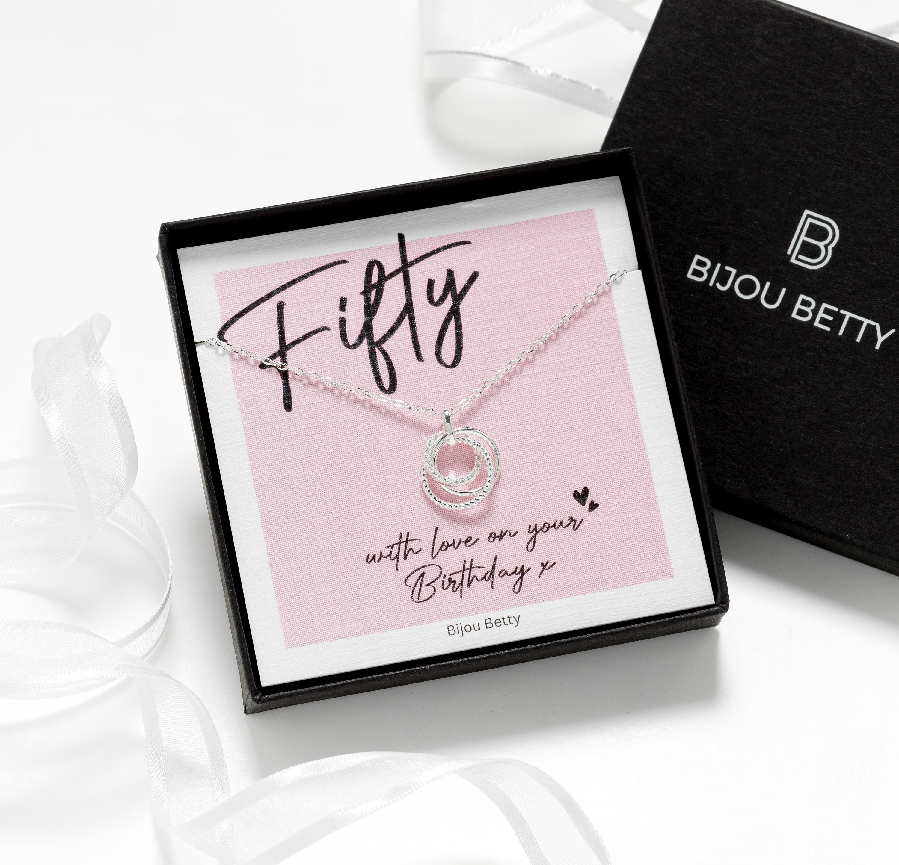 Model wearing silver 50th birthday necklace.