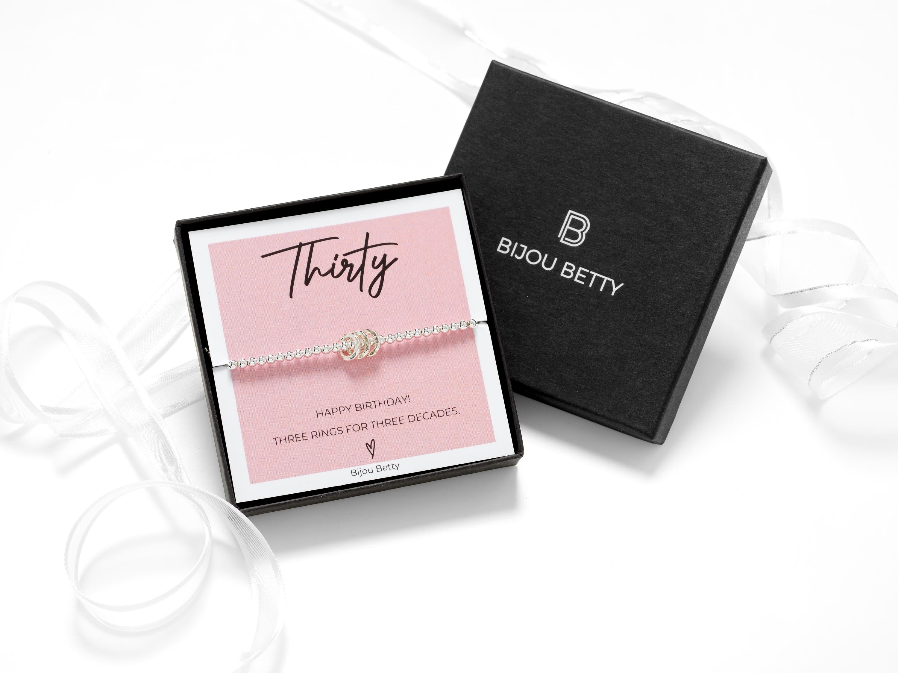 Bijou Betty’s 30th birthday bracelet gift set, 925 silver with three rings, in gift box with bag, tissue, and card: “Thirty - HAPPY BIRTHDAY!” Presented in a luxury gift box.