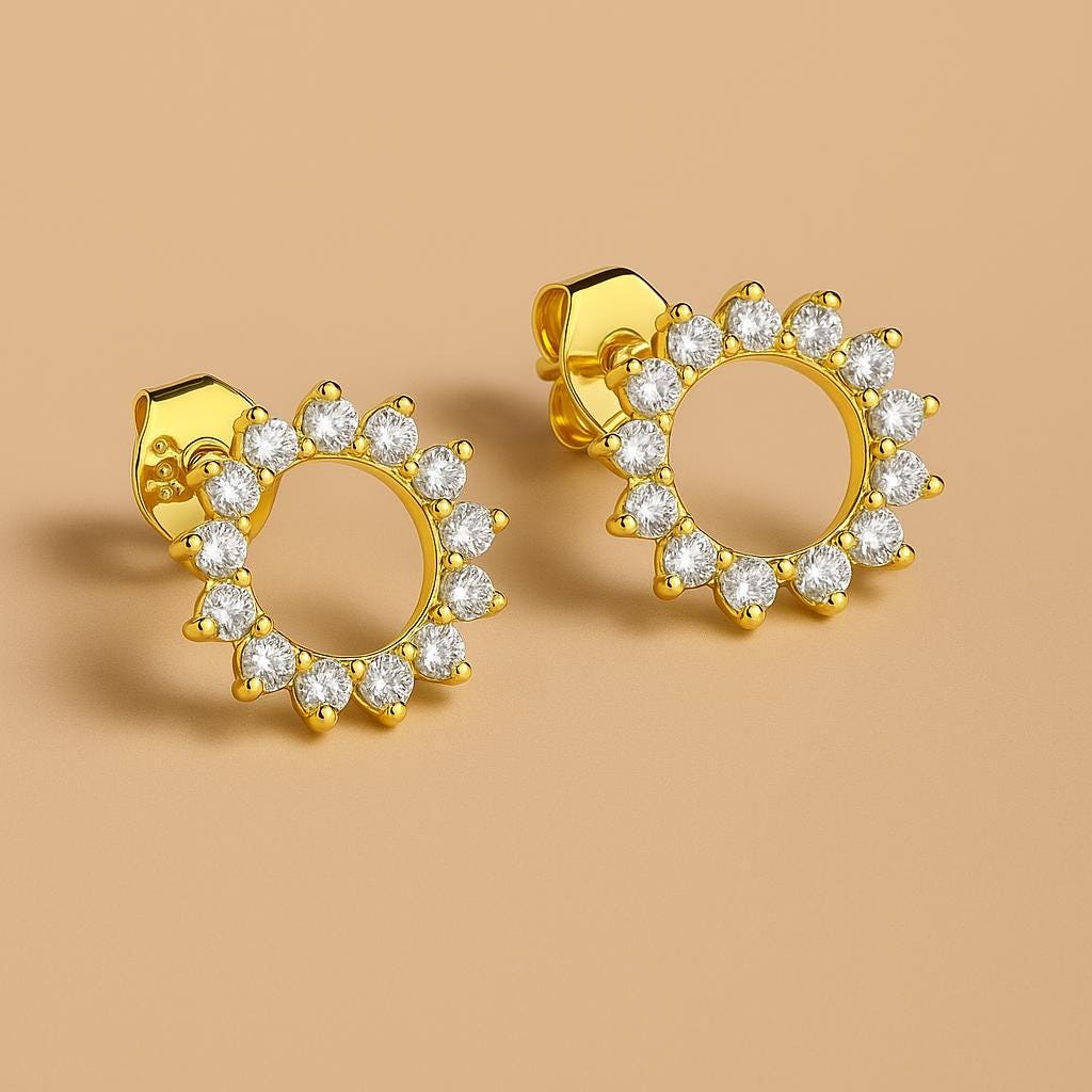 Close-up of Bijou Betty’s 925 silver sunburst stud earrings, 10mm with cubic zirconia with gold plate.