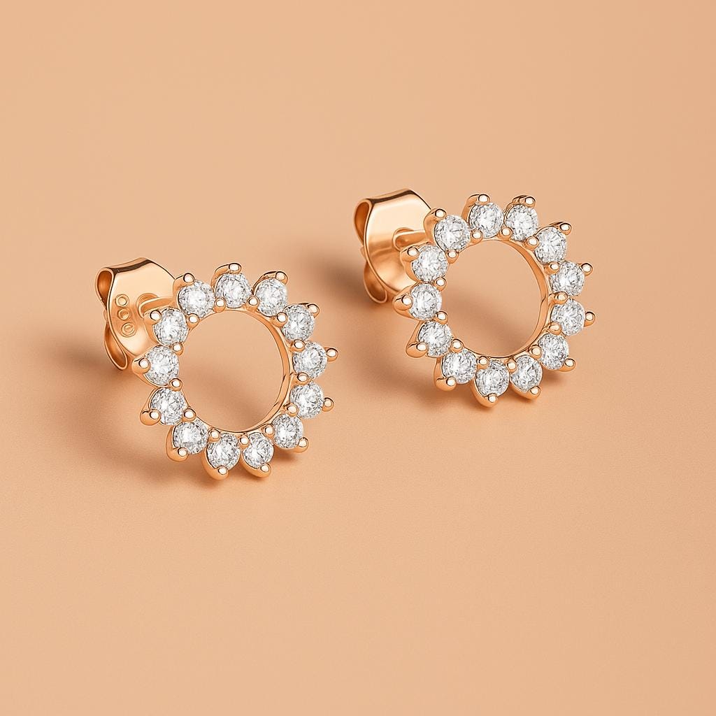 Close-up of Bijou Betty’s 925 silver sunburst stud earrings, 10mm with cubic zirconia with rose gold plate.