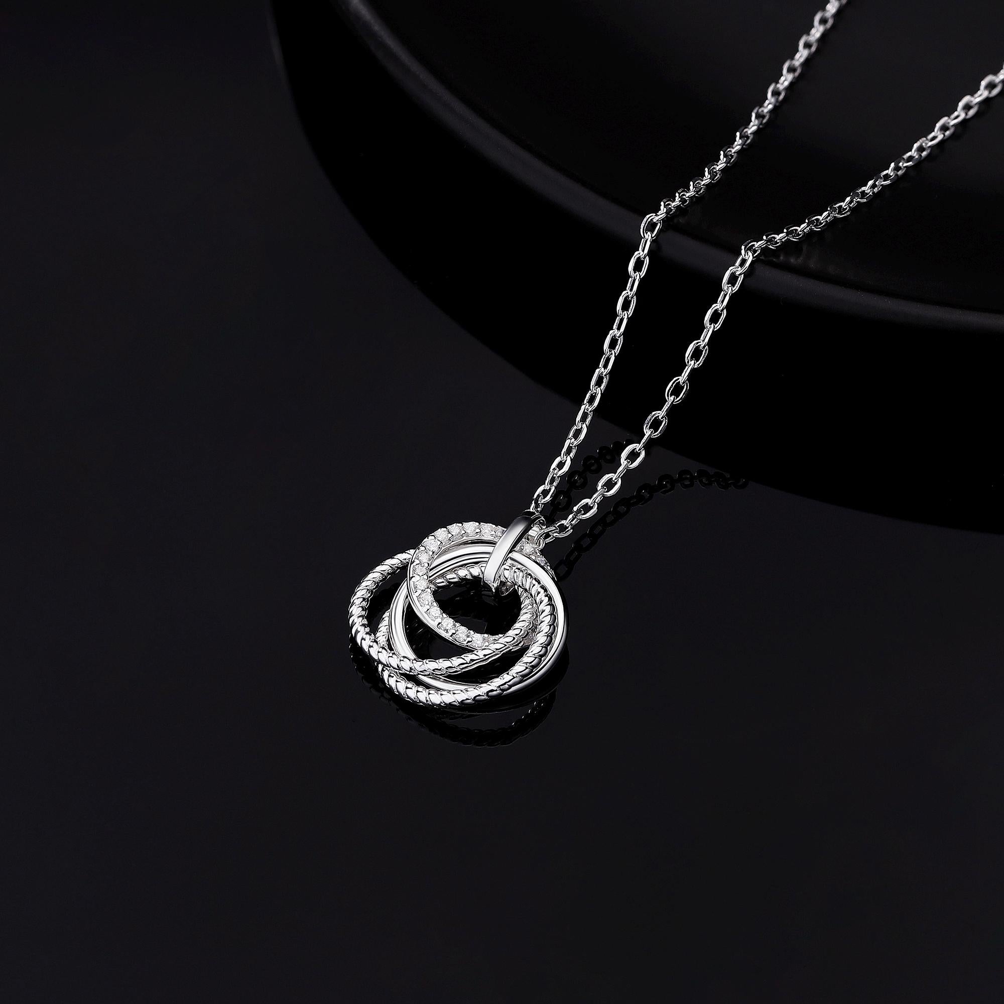 40th birthday decades necklace with 4 rings.  Solid sterling silver.