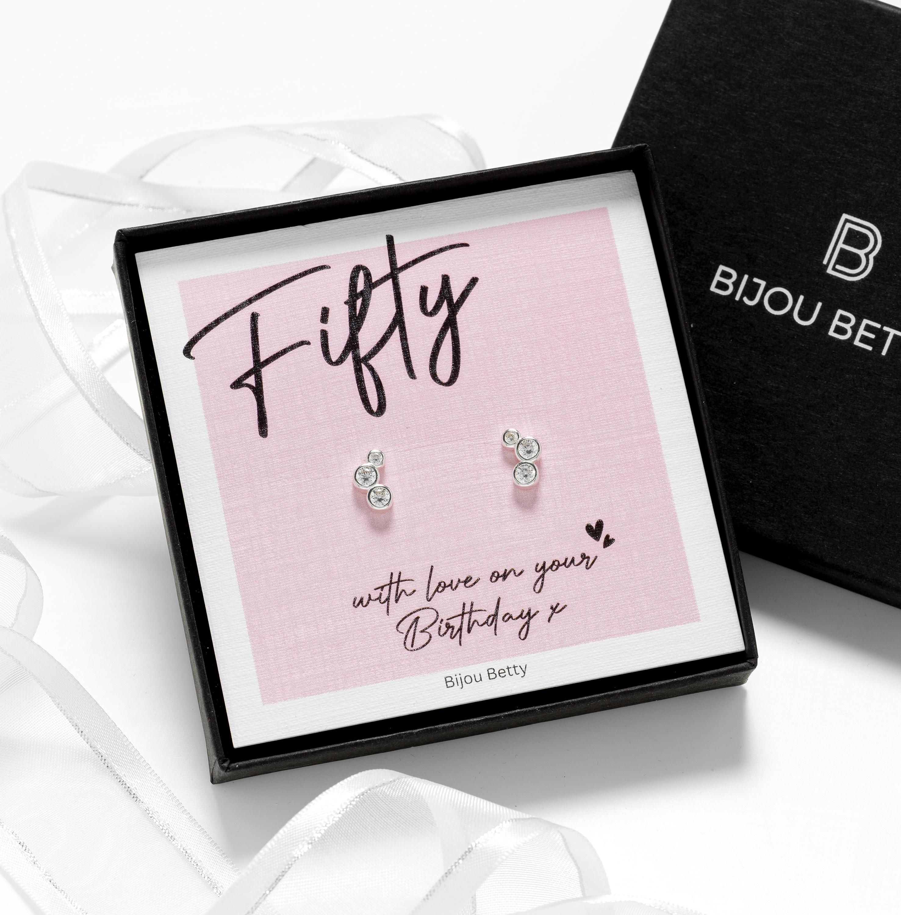 Close up of 50th birthday silver cz stud earrings.