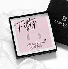 Close up of 50th birthday silver cz stud earrings.