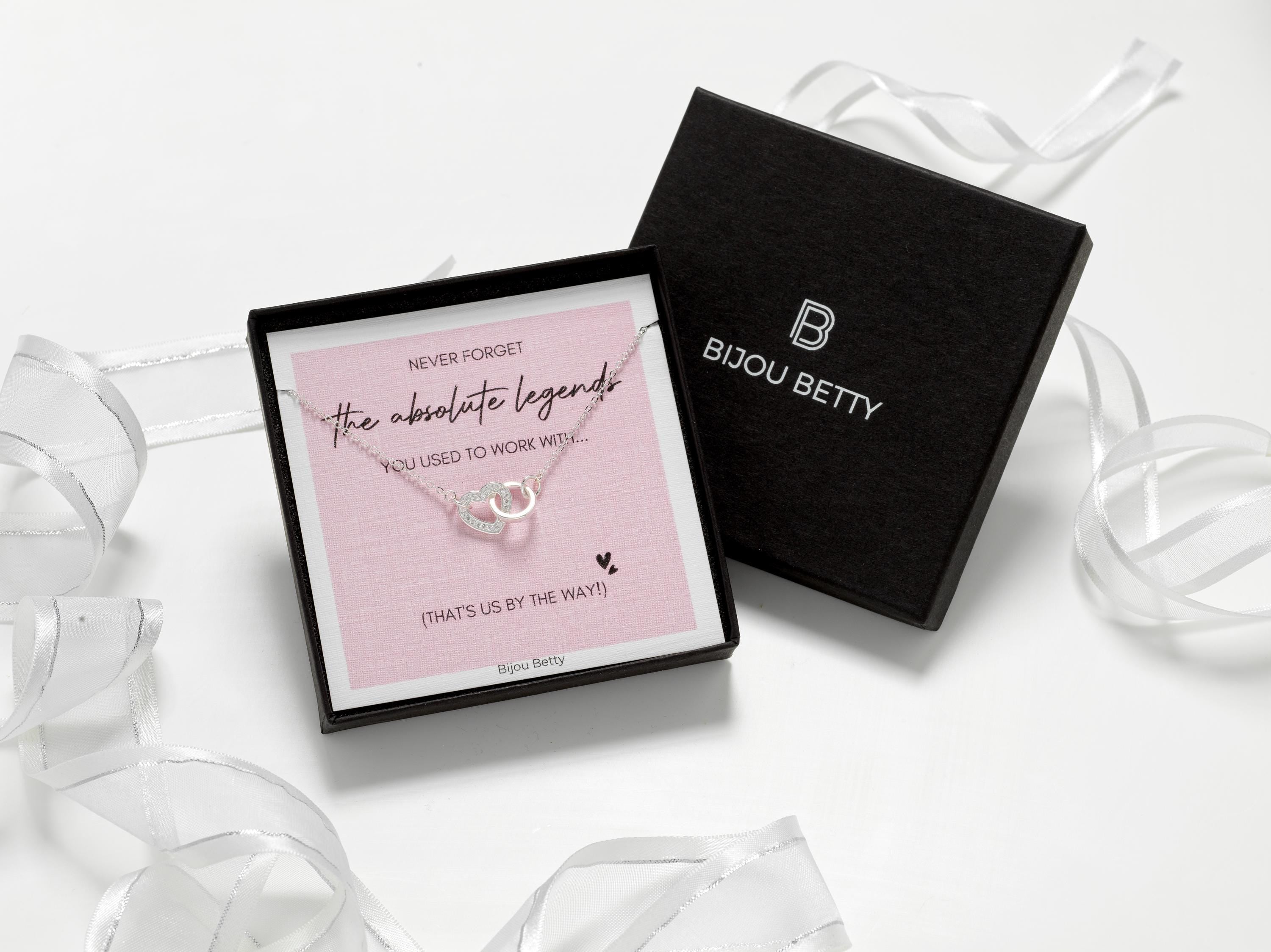 Colleague leaving gift.  Silver heart necklace in gift box.