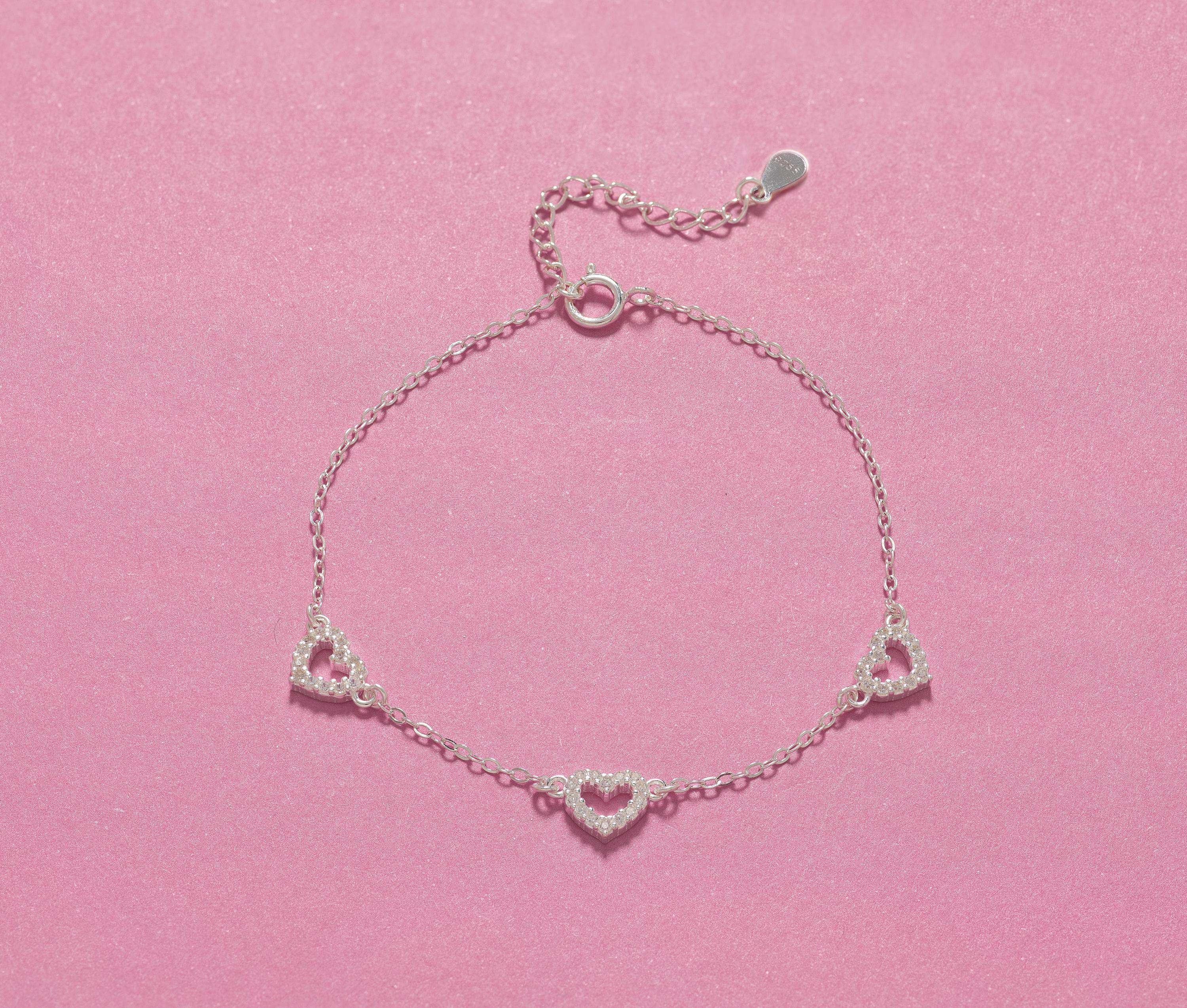 Close-up of 925 silver bracelet with three CZ hearts, perfect for 21st birthday gifts for sisters or friends.