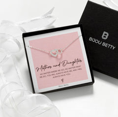Close-up of Bijou Betty’s 925 silver mother daughter necklace with 18mm x 10mm heart and circle pendant, cubic zirconia, on 16–18 inch chain, in gift box.