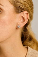 Model wearing 925 silver CZ heart 16th birthday earrings, making them an ideal gift for sisters or friends.